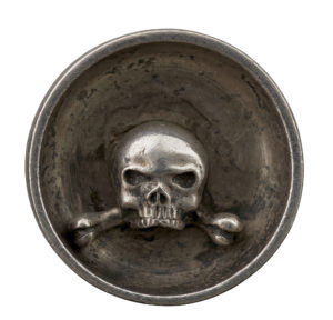 Deep relief on the reverse of this cast medal attributed to Drentwett, which features a vanitas theme.