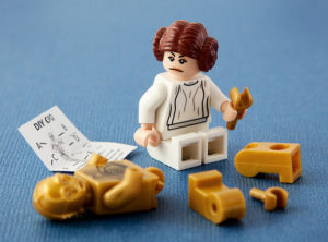 Princess Leia figure trying to put together C3PO